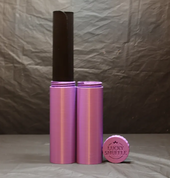 Purple Lucky Shuffle Playmat Tube with a rolled playmat and lid